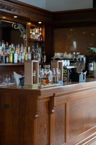 a bar in a restaurant with glasses on the counter at Bellevue San Lorenzo (Adults Only) in Malcesine