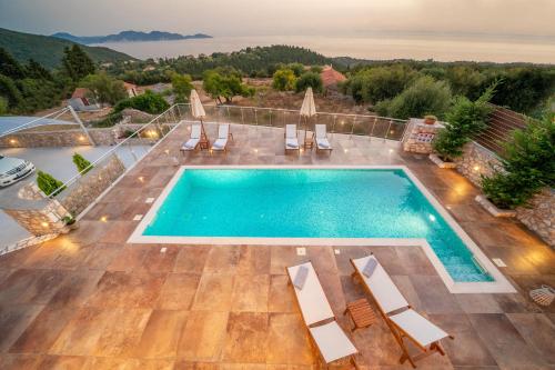 an overhead view of a swimming pool in a villa at Villa Cleopatra Fiskardo in Fiskardho