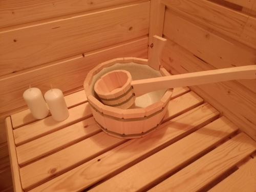 an inside view of a sauna with two candles at Przystanek Rospuda in Sucha Wieś