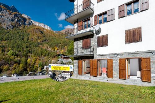 a building with a fire truck outside of it at HelloChalet - Maison Rue de la Neige - Family Ski Holiday walking distance skirun and gondola in Valtournenche
