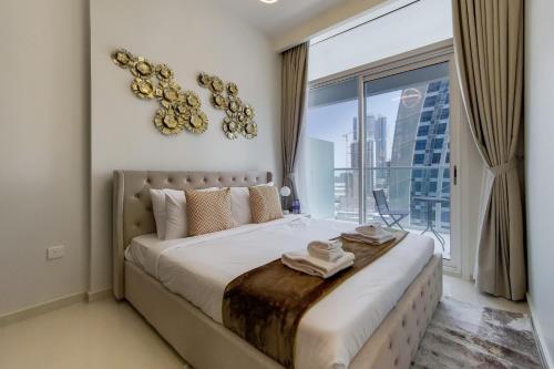 Postel nebo postele na pokoji v ubytování Primestay - Vera Residence Business Bay