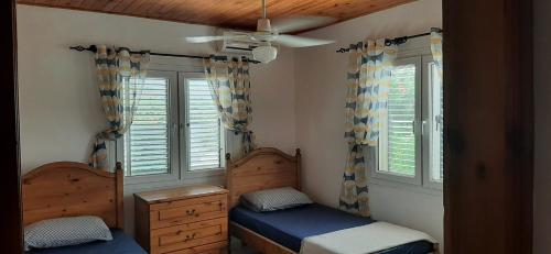 Ένα ή περισσότερα κρεβάτια σε δωμάτιο στο Villa bougainvillea with privite pool