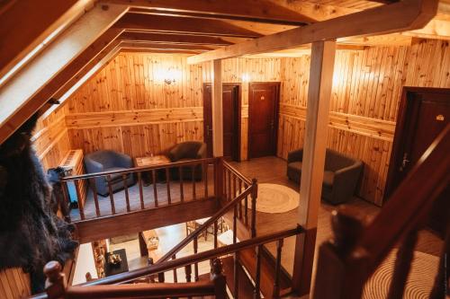 an overhead view of a living room in a log cabin at Casa Cheile Dâmbovicioarei - Cabana 2 in Dâmbovicioara