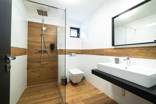 a bathroom with a sink and a shower at Lidový dům Opava in Opava