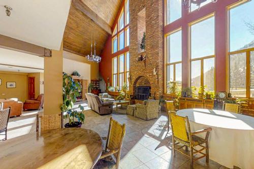a large living room with a table and chairs at Cascade 347 in Durango Mountain Resort