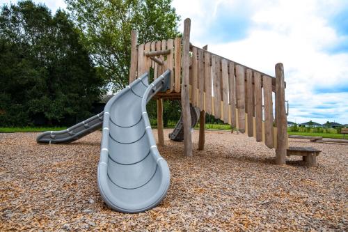 a slide on a playground in a park at HS#2- Modern Studio next to Premier Sports Complex in Bradenton