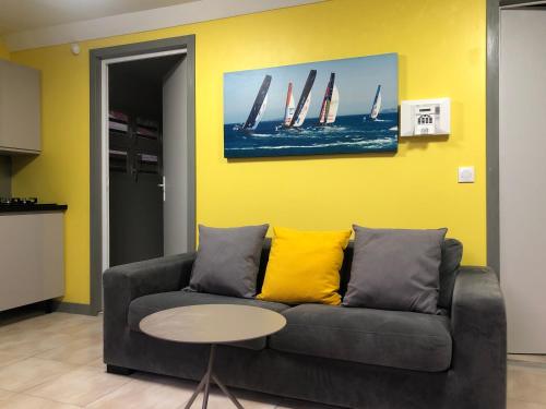 a living room with a couch and a table at Be On The Beach in Sainte-Anne