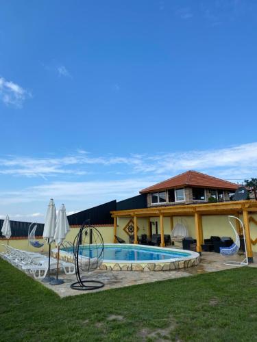 a house with a swimming pool in the yard at Vila Impresija, Fruška gora in Novi Sad
