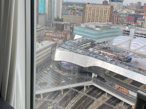 a view from a window of a city with traffic at Rotunda - New Street, City Centre, Birmingham in Birmingham