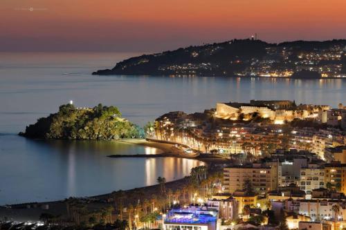 a view of a city at night at Apartamento Vista Altillo in Almuñécar