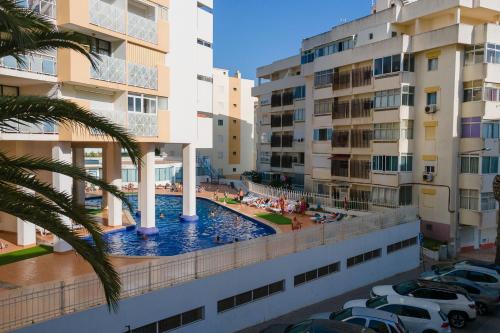 a view of the pool from the balcony of a building at Bright 1BDR Apartment W/Balcony & Pool by LovelyStay in Silves