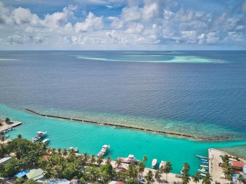 an aerial view of the islands in the ocean at Green Leaf Guest House - Omadhoo in Omadhoo