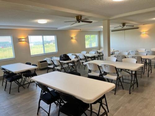 a classroom with tables and chairs in a room at Red Roof Inn Lawrenceburg in Lawrenceburg