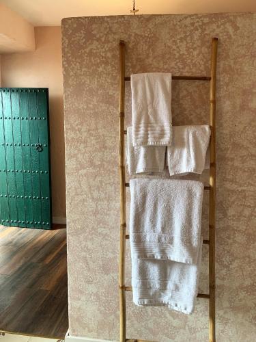 a towel rack with towels on it in a room at Patios del Agua in El Puerto de Santa María