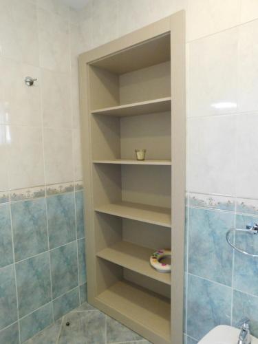 a bathroom with a toilet and a shower at Casa da Veiga in Lago