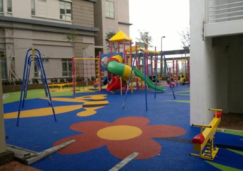 a playground with a slide and a play structure at Shaftsbury Residence Cyberjaya Wifi, Netflix, Free Parking in Cyberjaya