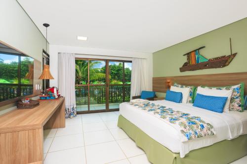 a bedroom with a bed and a balcony at Vivá Porto de Galinhas Resort in Porto De Galinhas
