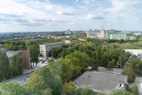 an aerial view of a city with trees and buildings at RentWill apartments Gold in Chişinău