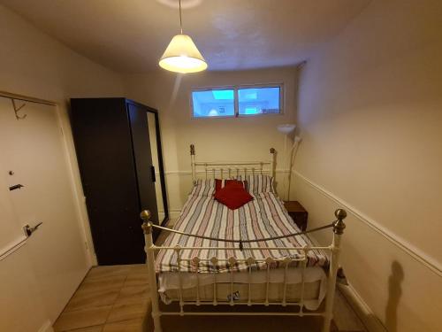 a bed in a room with a window at Ground floor flat , 31 lena street, easton,bristol avon, uk in Bristol