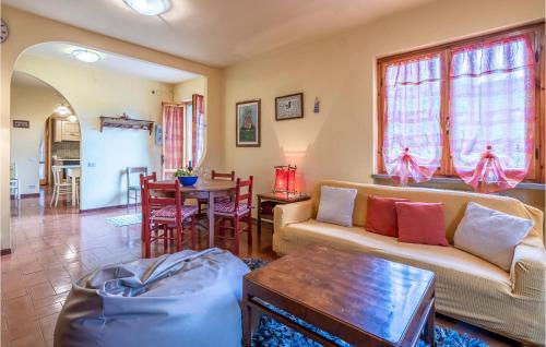 a living room with a couch and a table at 3 Bedroom Beautiful Home In Marliana in Marliana