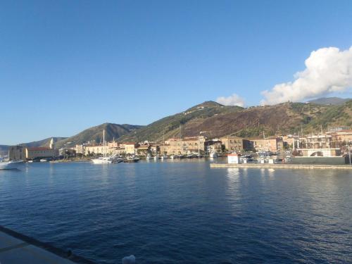 a view of a harbor with boats in the water at Tana delle Sirene Cilento Coast Acciaroli Sea Pollica in Acciaroli