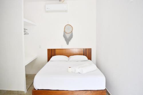 Säng eller sängar i ett rum på Xula Bacalar