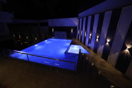 an overhead view of a pool at night at AJ Grand Hotel in Mangalore