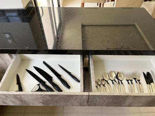 a drawer filled with knives and forks and spoons at La casa del Rincon in Querétaro