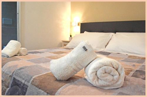 a bedroom with a bed with a stuffed animal on it at B&B Nuova Salento in Grottaglie