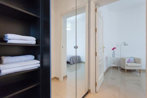 En eller flere senge i et værelse på Apartamentos Diaber Laraña