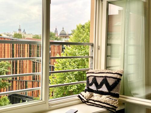 a window with a view of the city at H11 Aparthotel in Kraków