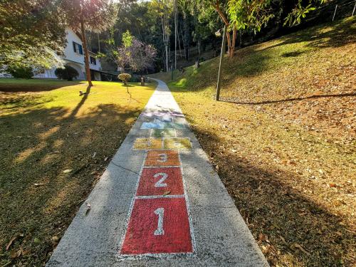 a road with the number two painted on it at Saison Resort & Spa in Itaipava
