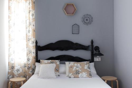 En eller flere senge i et værelse på Apartamentos Diaber Laraña