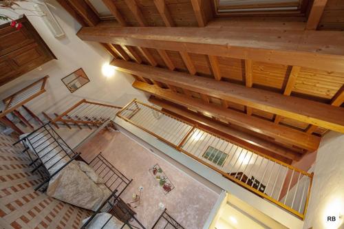 an overhead view of a large room with wooden ceilings at Affittacamere Cà Marcello in Monselice
