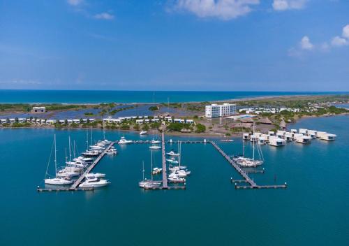 an aerial view of a marina with boats in the water at Marina Puerto Velero in Tubará