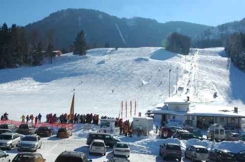 a group of cars parked on a snow covered slope at Landhotel Maiergschwendt inkl Chiemgaukarte in Ruhpolding