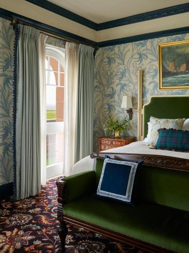 a bedroom with a green bed and a window at Marine Troon in Troon