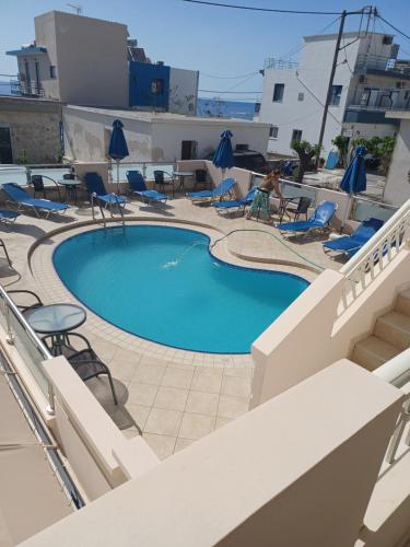 a swimming pool on the balcony of a hotel at Haris Studios in Palaiochora