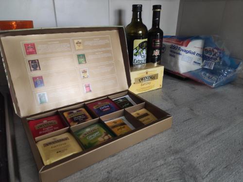 a bottle of wine and a box of beer at Casa panoramica in Attimis