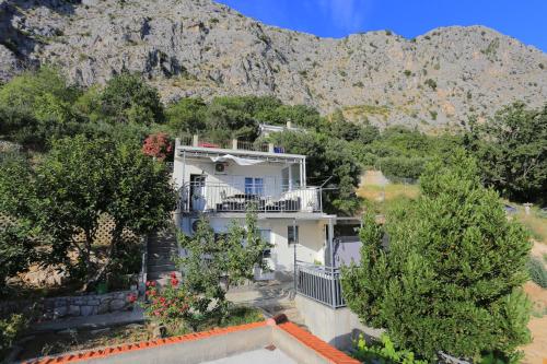 Fotografia z galérie ubytovania Holiday house with a swimming pool Omis - 19020 v Omise