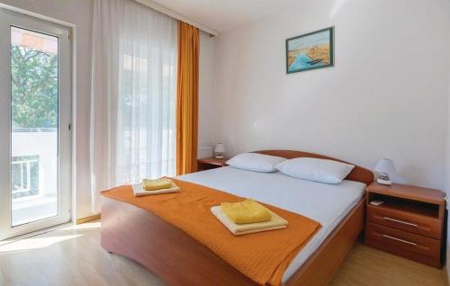 a bedroom with a bed and a large window at Seaside holiday house Duba, Neretva Delta - Usce Neretve - 19240 in Klek