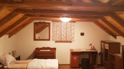 a bedroom with a bed and a dresser and a mirror at Family friendly house with a parking space Garesnica, Bjelovarska - 19166 in Garešnica