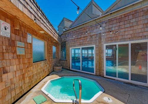 a swimming pool in the back of a building at Embarcadero Resort in Newport