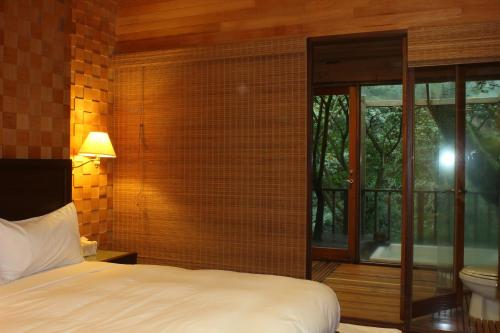 A bed or beds in a room at Silk Valley SPA Resort