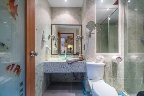 a bathroom with a toilet and a sink and a shower at Patong Tower Condominium by Lofty in Patong Beach
