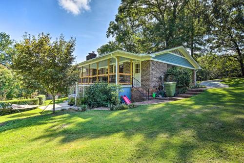 a house with a green lawn in front of it at Clemson Getaway Less Than 3 Mi to Memorial Stadium! in Clemson