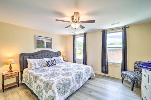a bedroom with a bed and a ceiling fan at Bright Boone Home Walk to Appalachian State! in Boone