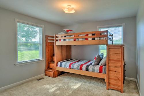 a bedroom with two bunk beds and two windows at Berryville Home Near Wineries Mountain Views in Berryville