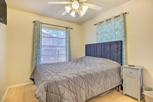a bedroom with a bed and a ceiling fan at San Antonio Home with Yard, 7 Mi to SeaWorld! in San Antonio