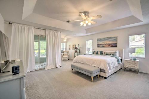 a bedroom with a bed and a ceiling fan at Crystal River Gem Near Three Sisters Springs! in Crystal River